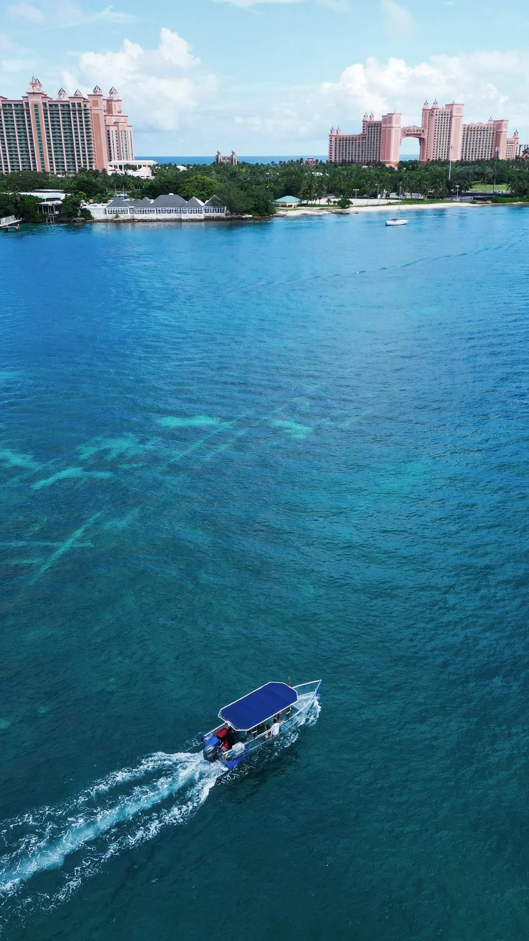An aerial view of the clear boat with Nassau in the distance